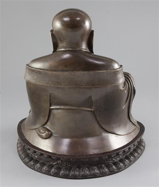 A large Chinese bronze seated figure of Budai, height 23cm excl. lotus carved hardwood stand, total weight 5.95kg